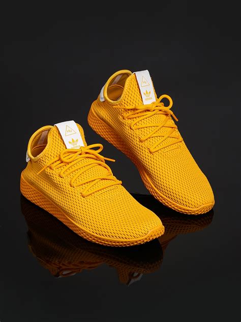 adidas yellow sneakers shoes.